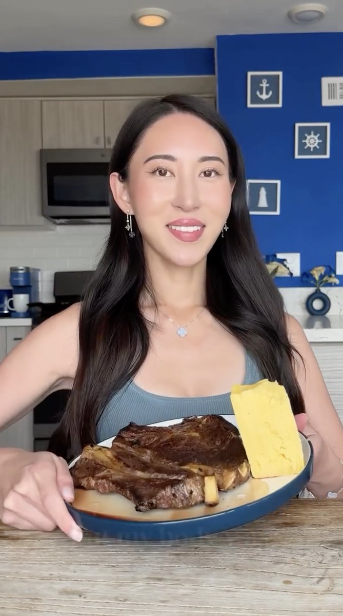 Bella, founder of the Steak and Butter Gang, holding a plate of steak and butter